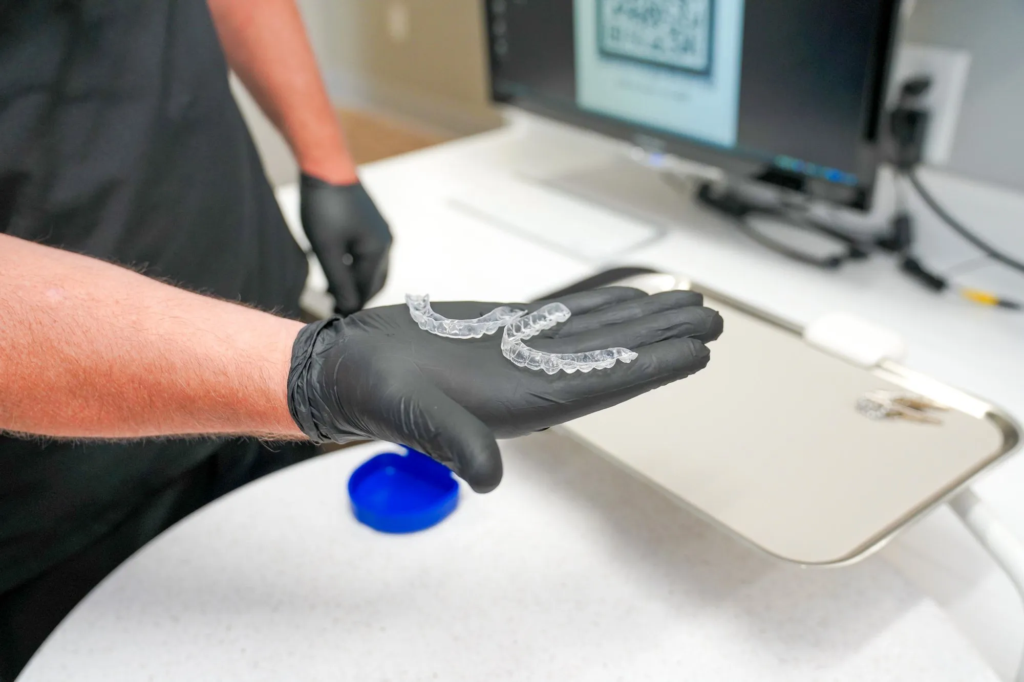 A dental appliance being checked against a digital model